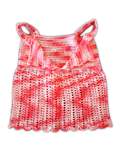 Foto das costas do vestido, agora com os botões abertos.