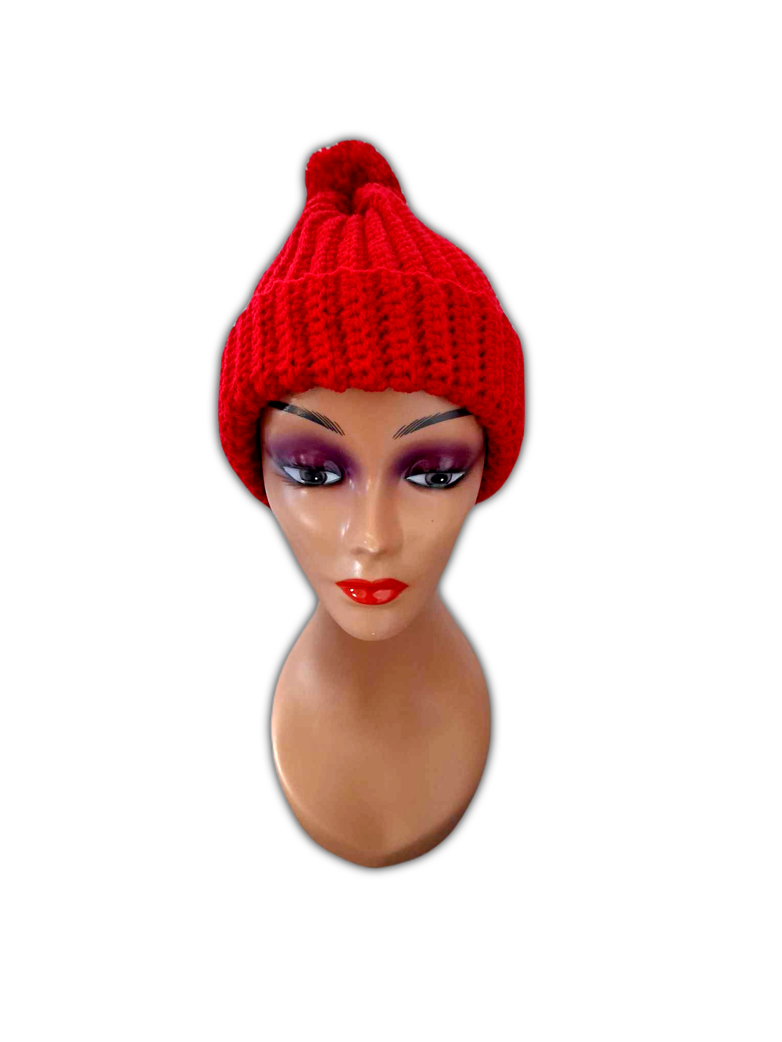 Outro angulo da parte da frente do gorro, para destacar com mais pormenor os seus padrões e ainda o pompom que tem no topo.